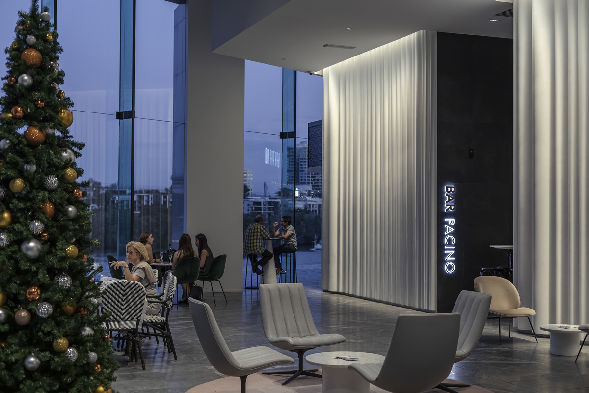 Lobby of 175 Eagle Street, Brisbane, featuring ERCO wallwashing and Christmas tree.