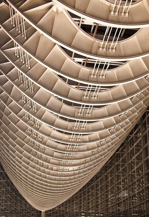 Steel structure at Tokyo International Forum, illuminated by ERCO spotlights for energy efficiency.