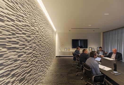 Conference room featuring wallwashing for visual comfort and spatial design.