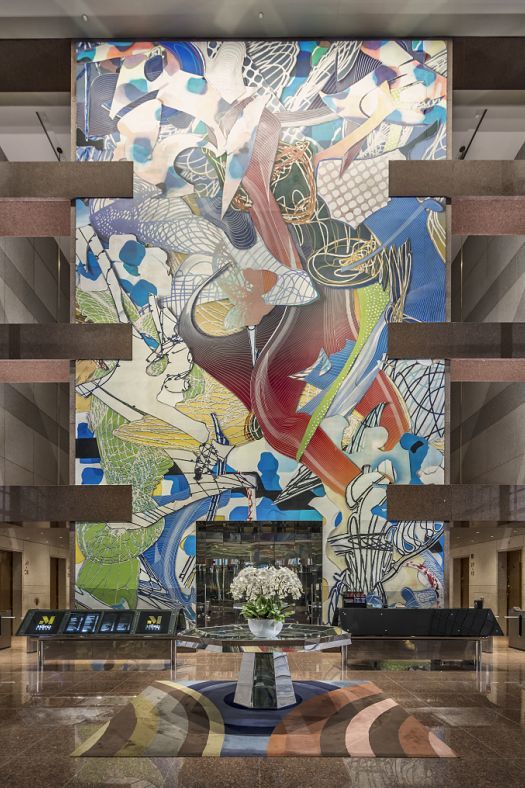 Wall art with wallwashing effect in a foyer, creating brightness and orientation.