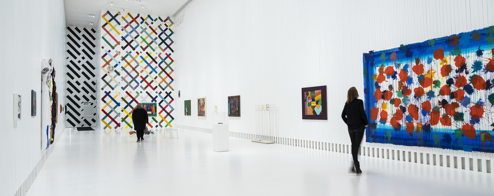 Art gallery featuring wallwashing to enhance artwork and provide spatial orientation.