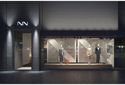 Illuminated mannequins in a clothing store, featuring ERCO spotlights for effective merchandise presentation.