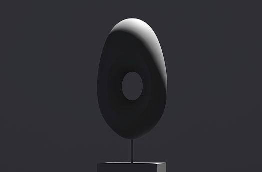 Accent lighting highlights a modern decorative object, modelling its form with directional light.