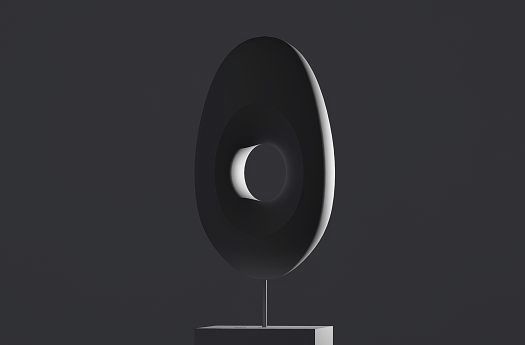 Abstract sculpture with accent lighting to highlight form and texture.