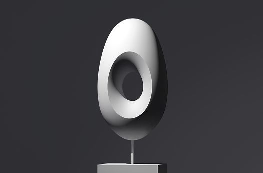 Abstract sculpture using accent lighting to model and highlight its form.