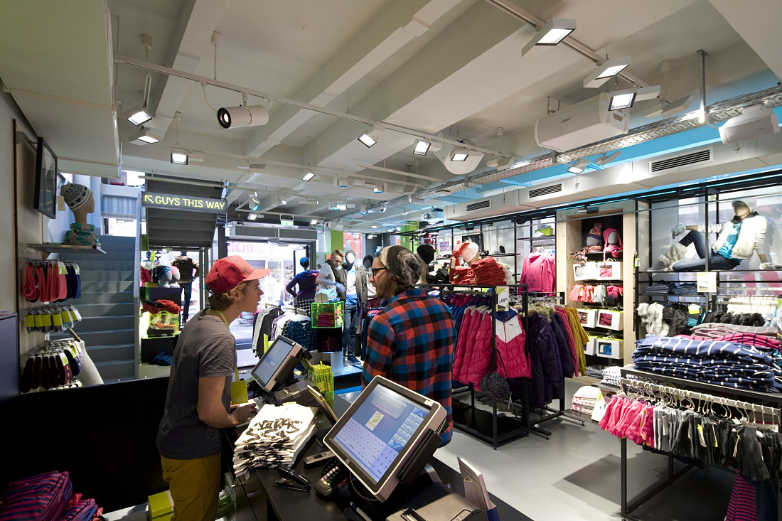 Adidas NEO store in Cologne featuring ERCO LED lighting for dynamic and effective retail design.