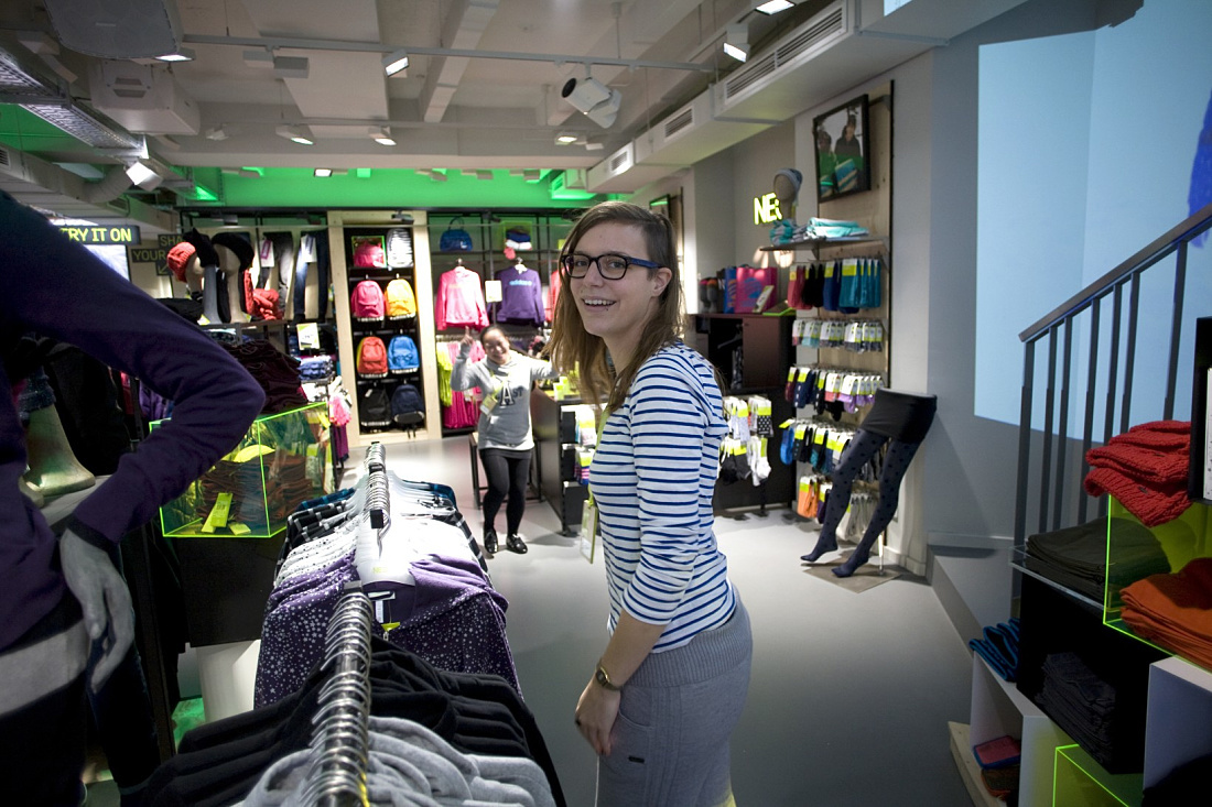 Adidas NEO store in Cologne featuring ERCO LED lighting for dynamic retail design.