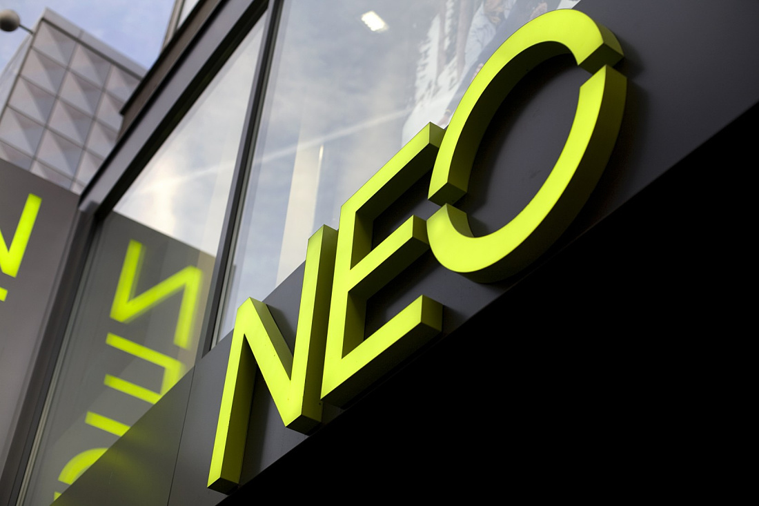 Illuminated Adidas NEO logo on the Cologne store, showcasing effective LED retail design.