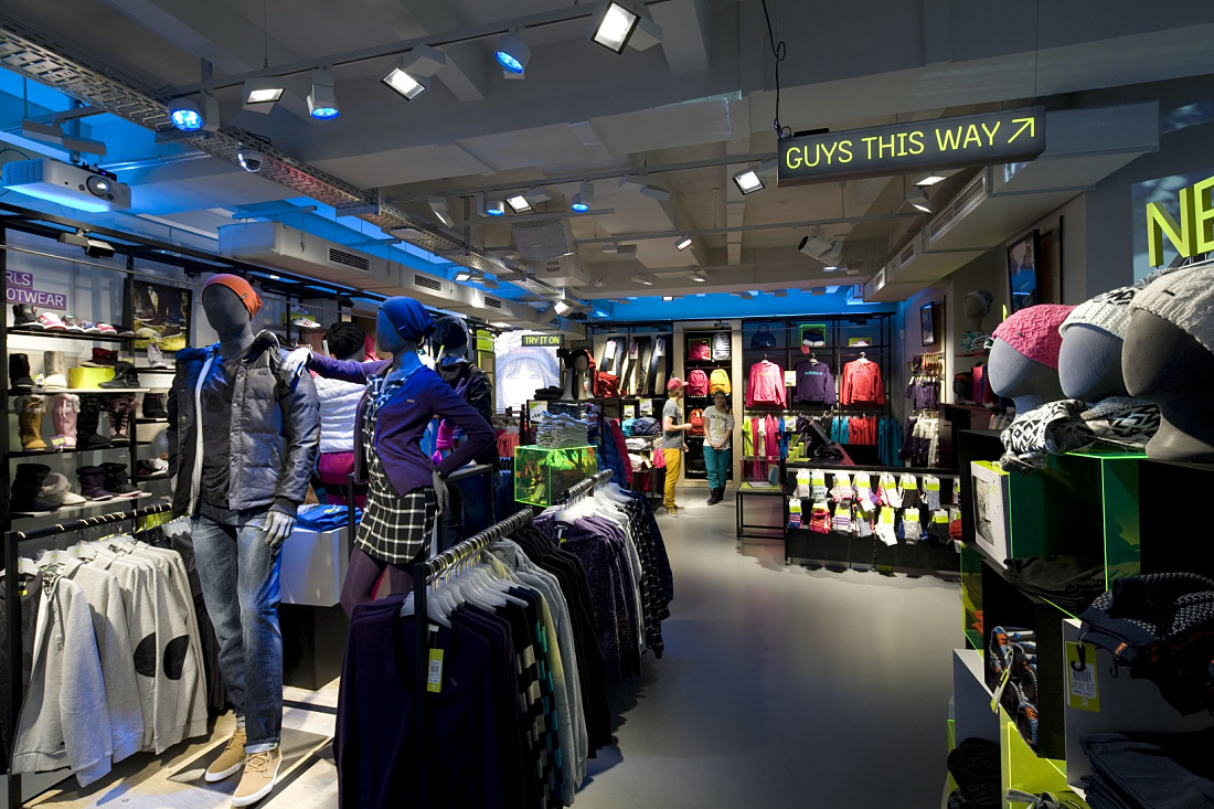 Adidas NEO store in Cologne featuring ERCO LED lighting, providing dynamic and effective retail lighting solutions.