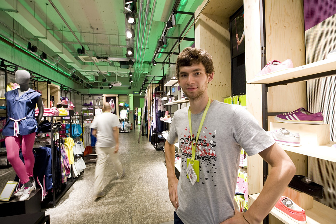 Adidas NEO store illuminated with ERCO Optec spotlights and varychrome LED lighting for dynamic accents.