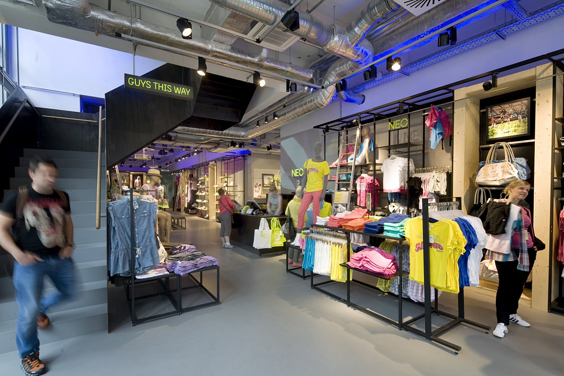 Adidas NEO store interior featuring Optec spotlights and dynamic ERCO LED lighting.