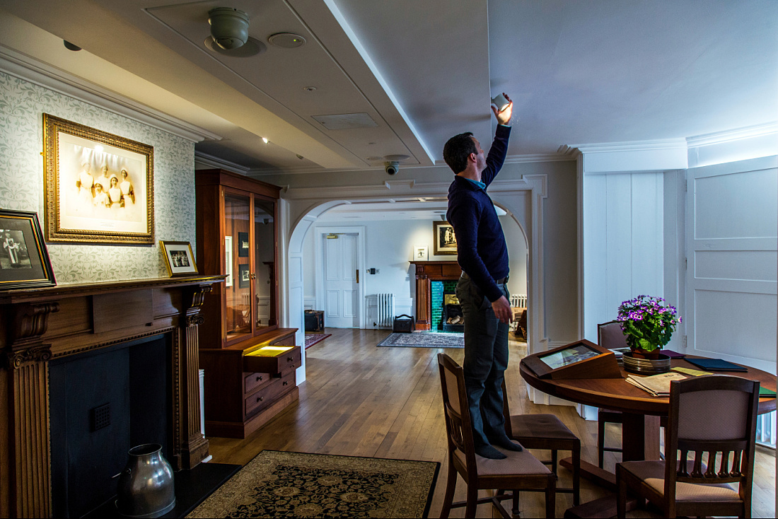 ERCO light: Man adjusts Pollux spotlight at Airfield Farm Museum, Dublin.