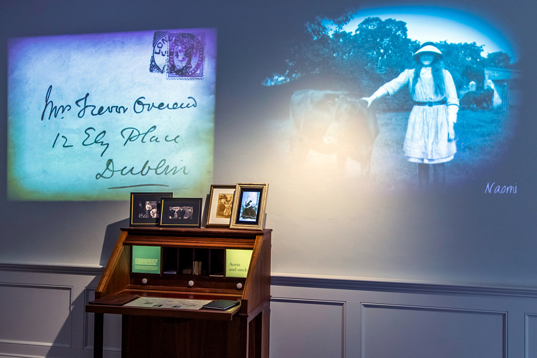 Airfield Farm Museum exhibit featuring illuminated historic Overend family documents and photos.