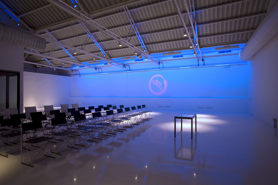 Aldo Coppola showroom illuminated by ERCO lighting, showcasing modern hairstyling trends.