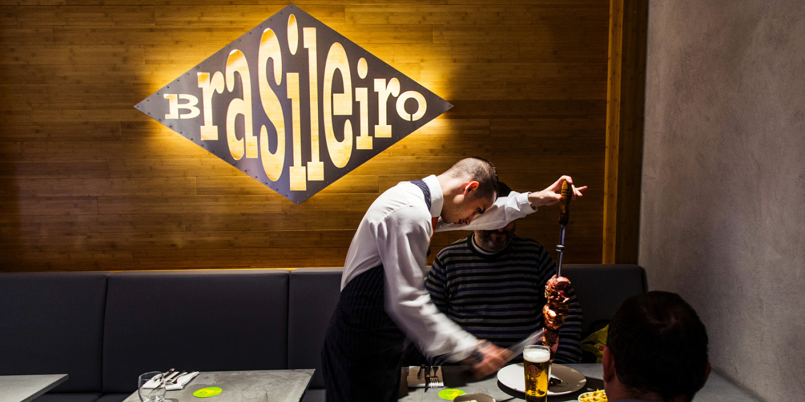 ERCO LED lighting in Ambiente Brasileiro restaurant, Prague, serving Brazilian churrasco.