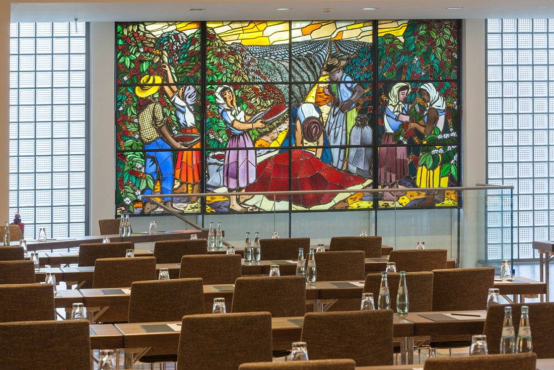 Ameron Hotel Speicherstadt conference room with stained glass window and ERCO lighting.