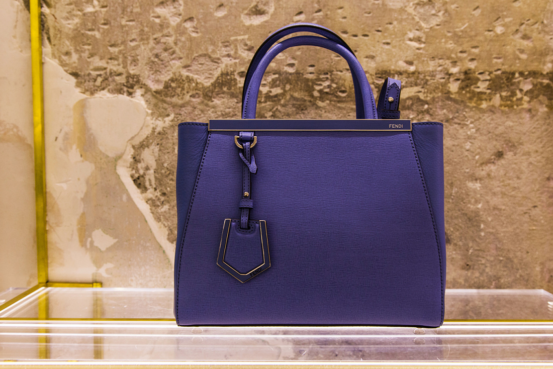 Fendi purple handbag in Milan boutique, lit by ERCO Optec spotlights.