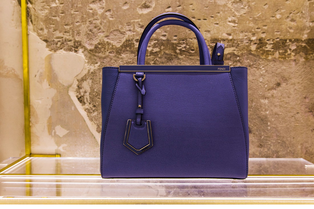 Fendi purple handbag in Milan boutique, lit by ERCO Optec spotlights.