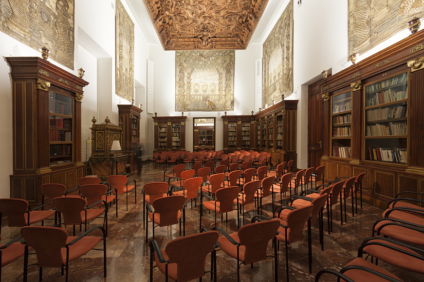 Archaeological Museum, Madrid: Reading room with ERCO lighting highlighting historical artifacts.