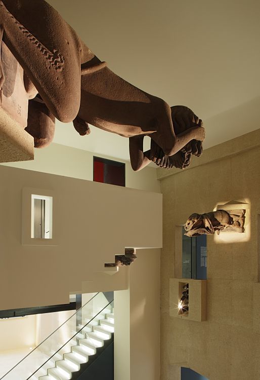 Illuminated sculptures at the Augustinian Museum, Freiburg, highlighted by ERCO lighting.
