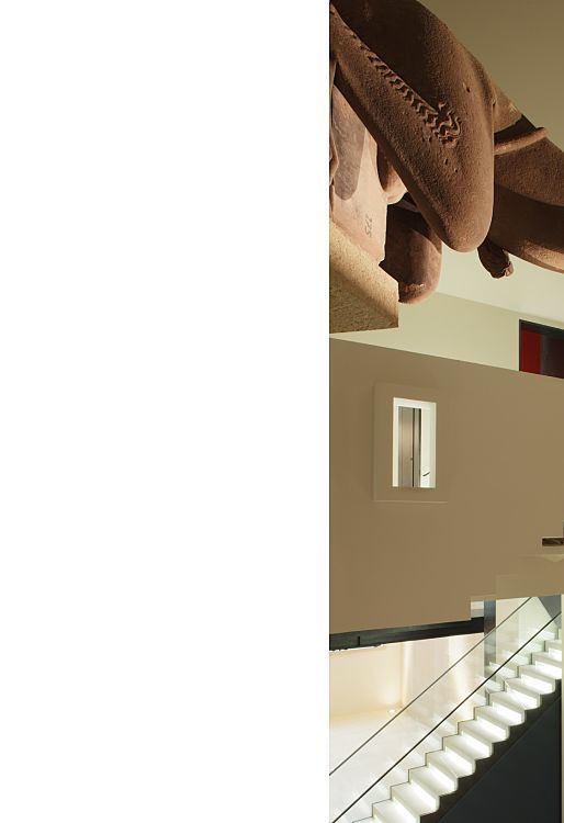 Illuminated sculptures at the Augustinian Museum, Freiburg, highlighted by ERCO lighting.
