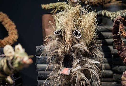 Cultural mask made of feathers and straw, exhibited at the Venice Biennale.