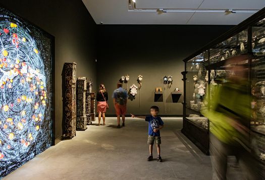 Visitors view art illuminated by ERCO spotlights in the Australian Pavilion at the Venice Biennale.