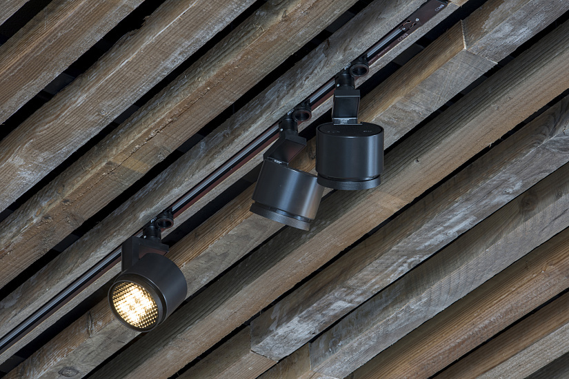 ERCO Parscan LED spotlights illuminate the Axel Vervoordt Gallery's wooden ceiling.