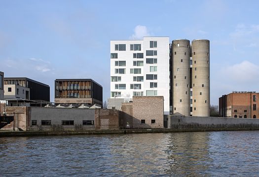 Axel Vervoordt Gallerys industrial architecture and art by the water, lit by ERCO LED lighting.