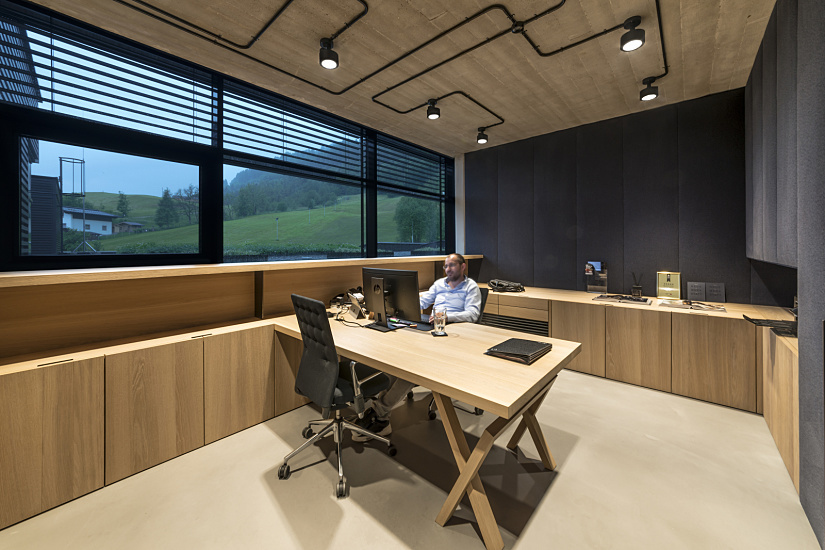 Bernd Gruber's office featuring ERCO Parscan spotlights and accent lighting.