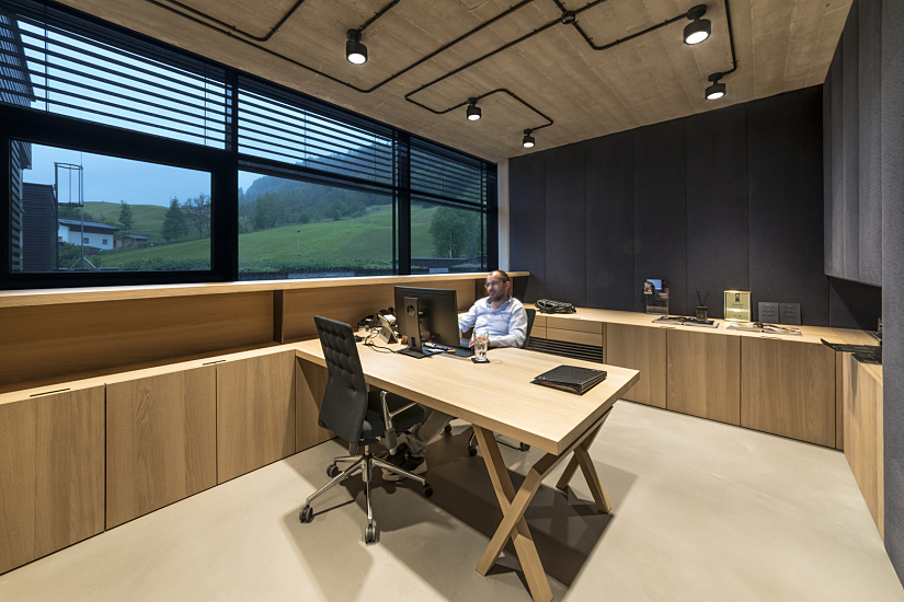Bernd Gruber's office featuring ERCO Parscan spotlights and accent lighting.