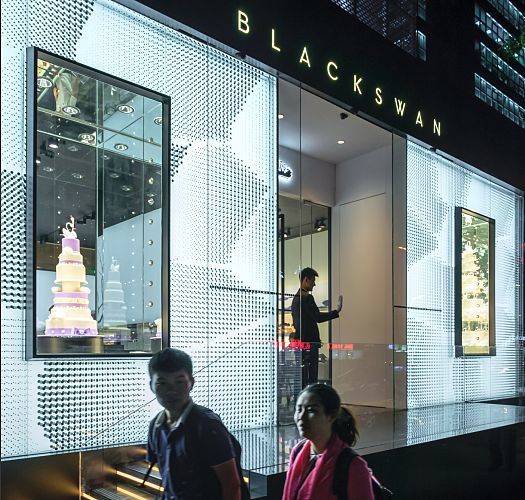Black Swan patisserie in Beijing, illuminated by ERCO Optec spotlights for high-contrast cake displays.