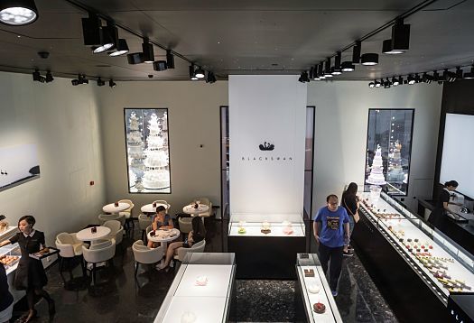 Interior of Black Swan patisserie in Beijing, featuring ERCO Optec spotlights for high-contrast product presentation.