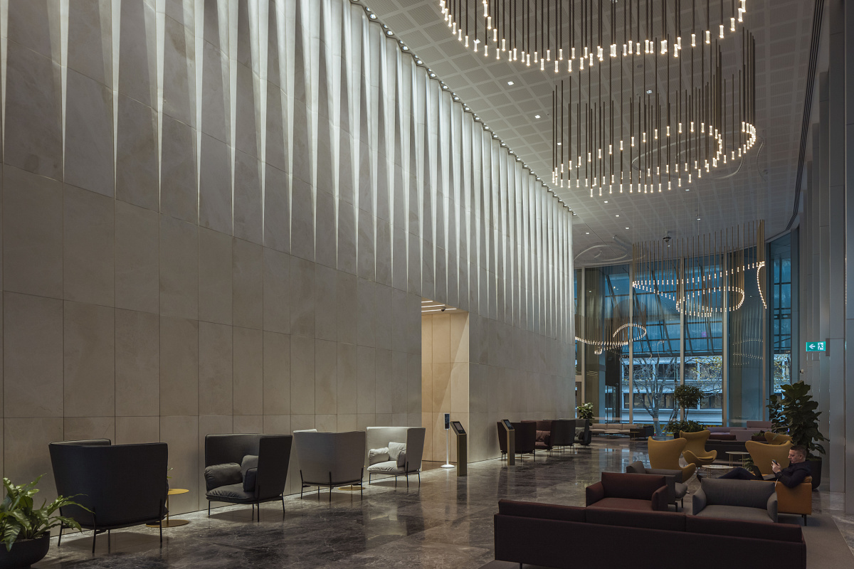 Bourke Place Lobby in Melbourne featuring ERCO Gimbal recessed spotlights for wallwashing.