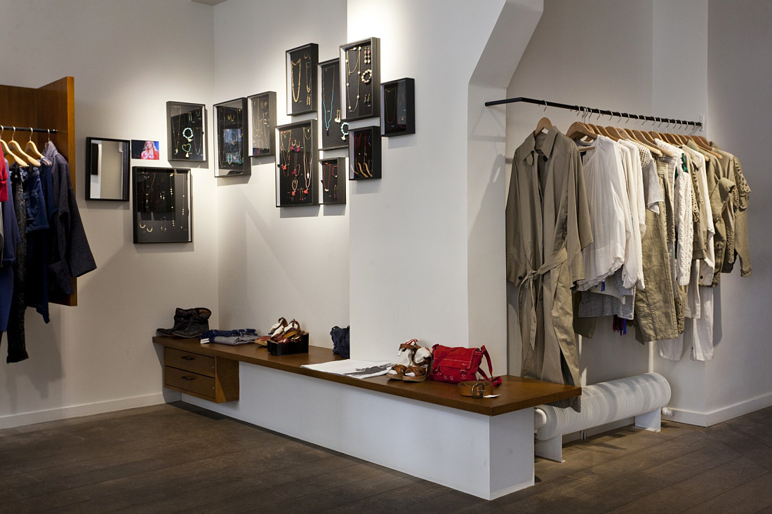 Modern LED lighting in a Paris fashion boutique, showcasing clothing and jewelry.