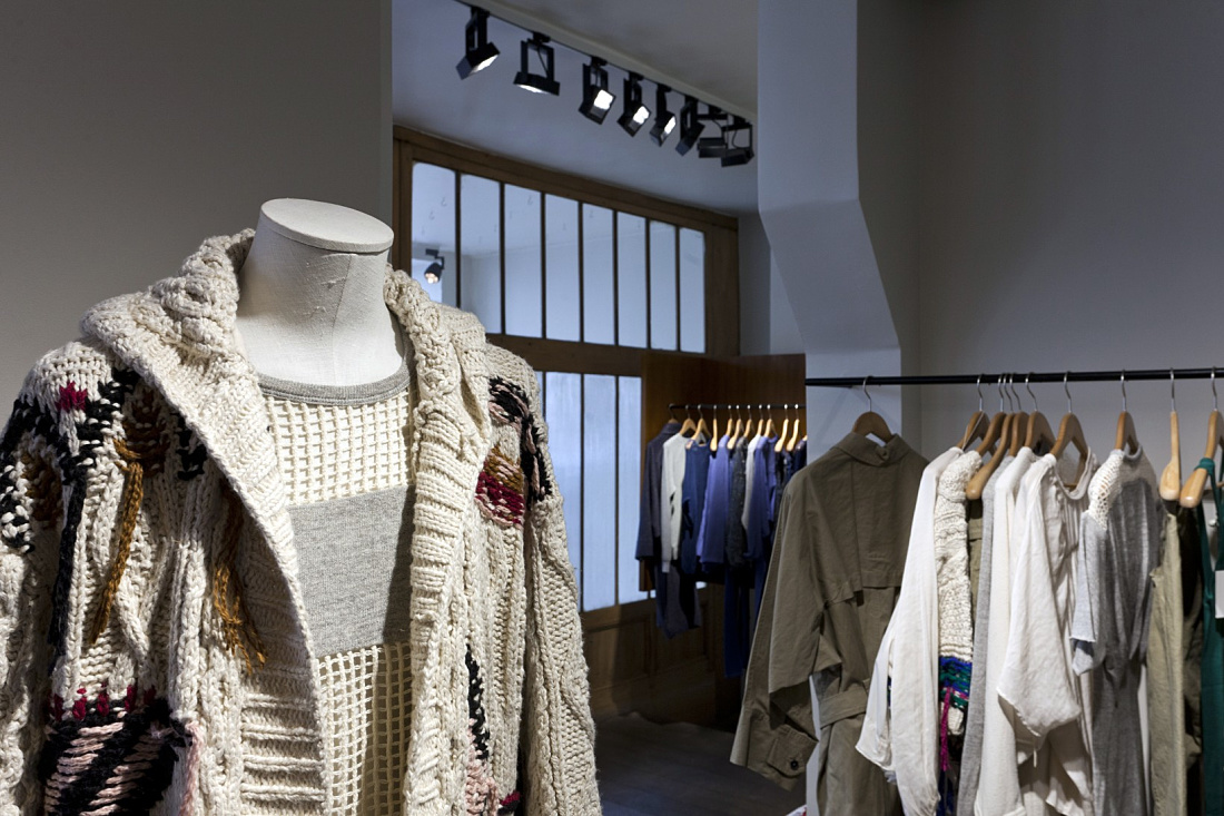 Fashionable knit cardigan on a mannequin in a Paris boutique, lit by ERCO LED spotlights.