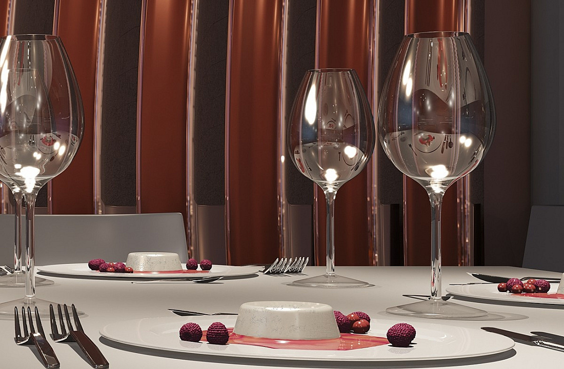 Elegant table setting with brilliant glassware and dessert, enhanced by light reflections.