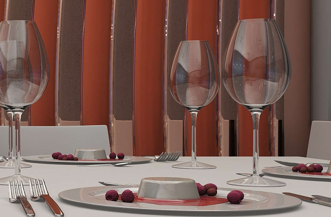 Table setting with wine glasses and dessert, highlighting the brilliance of light.