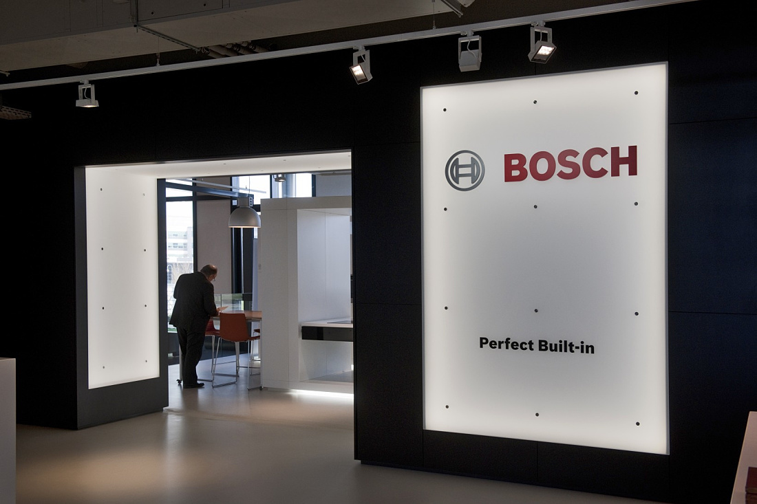 Illuminated Bosch logo in BSH office, Hoofddorp, featuring ERCO LED lighting.
