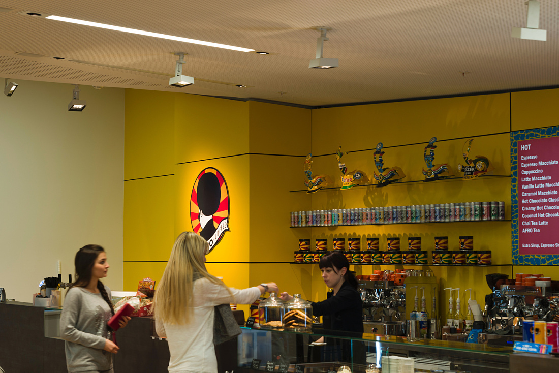 Cafeteria at Vienna University with ERCO LED lighting, designed for social interaction.
