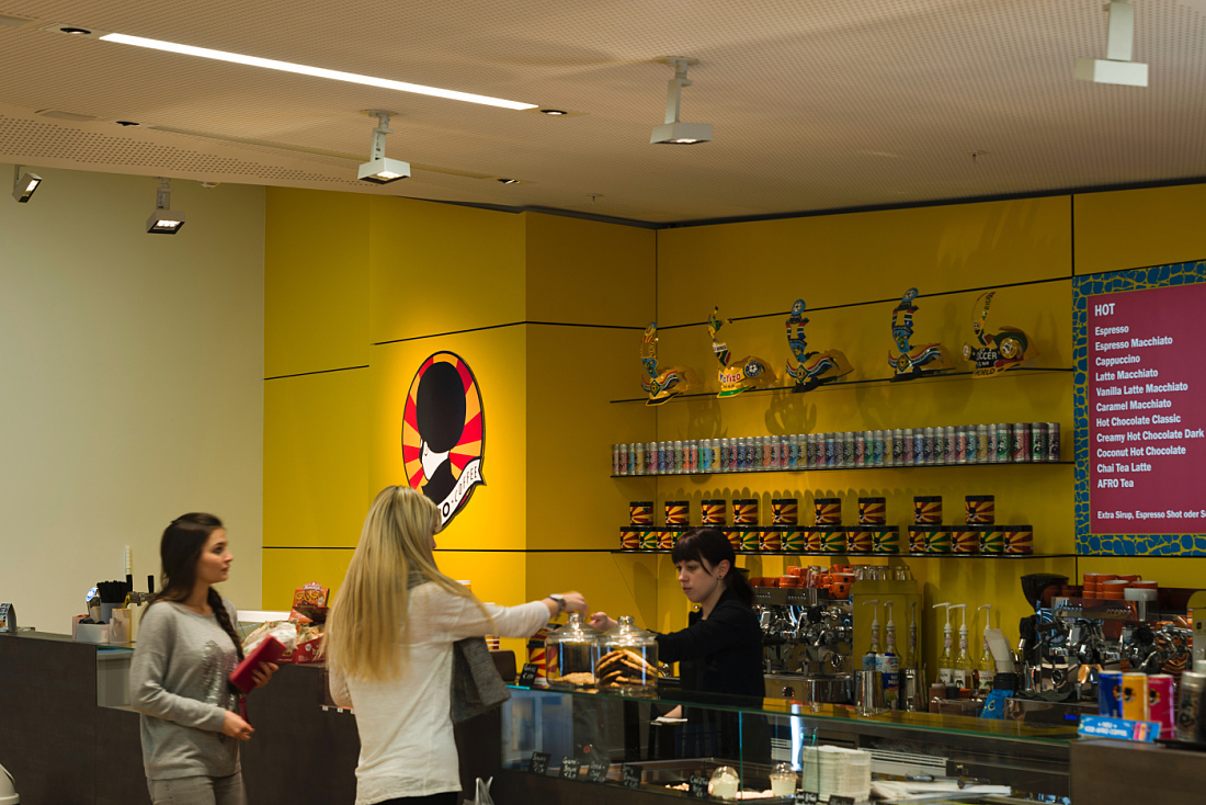 Cafeteria at Vienna University with ERCO LED lighting, designed for social interaction.