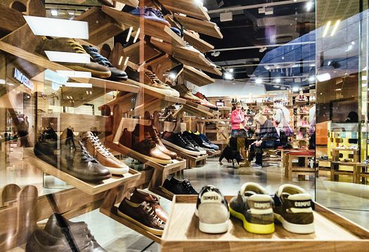 Camper shoe store in Barcelona featuring LED lighting for accentuated product displays.