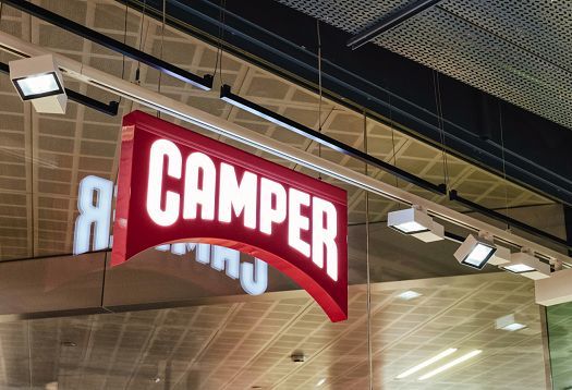 Camper store illuminated sign in Barcelona, featuring ERCO LED lighting.