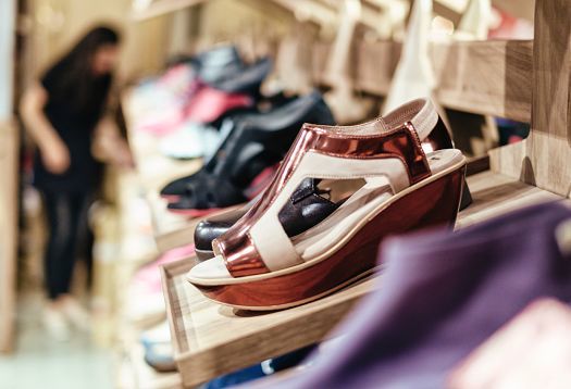 Camper shoes on display in a Barcelona store, showcasing minimalist design.