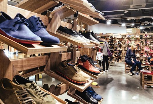 Camper shoe store in Barcelona: LED lighting accentuates inclined display spaces without shadows.