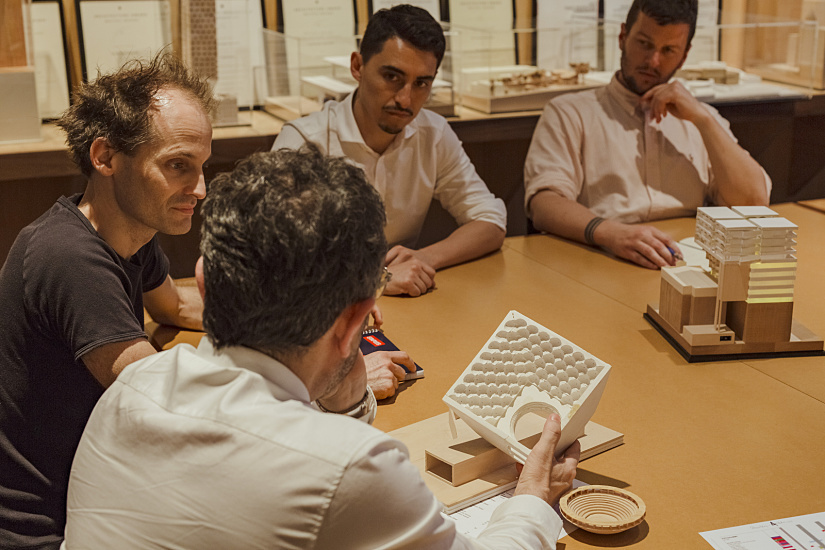 Architects discussing ERCO lighting design for a Sydney office building.