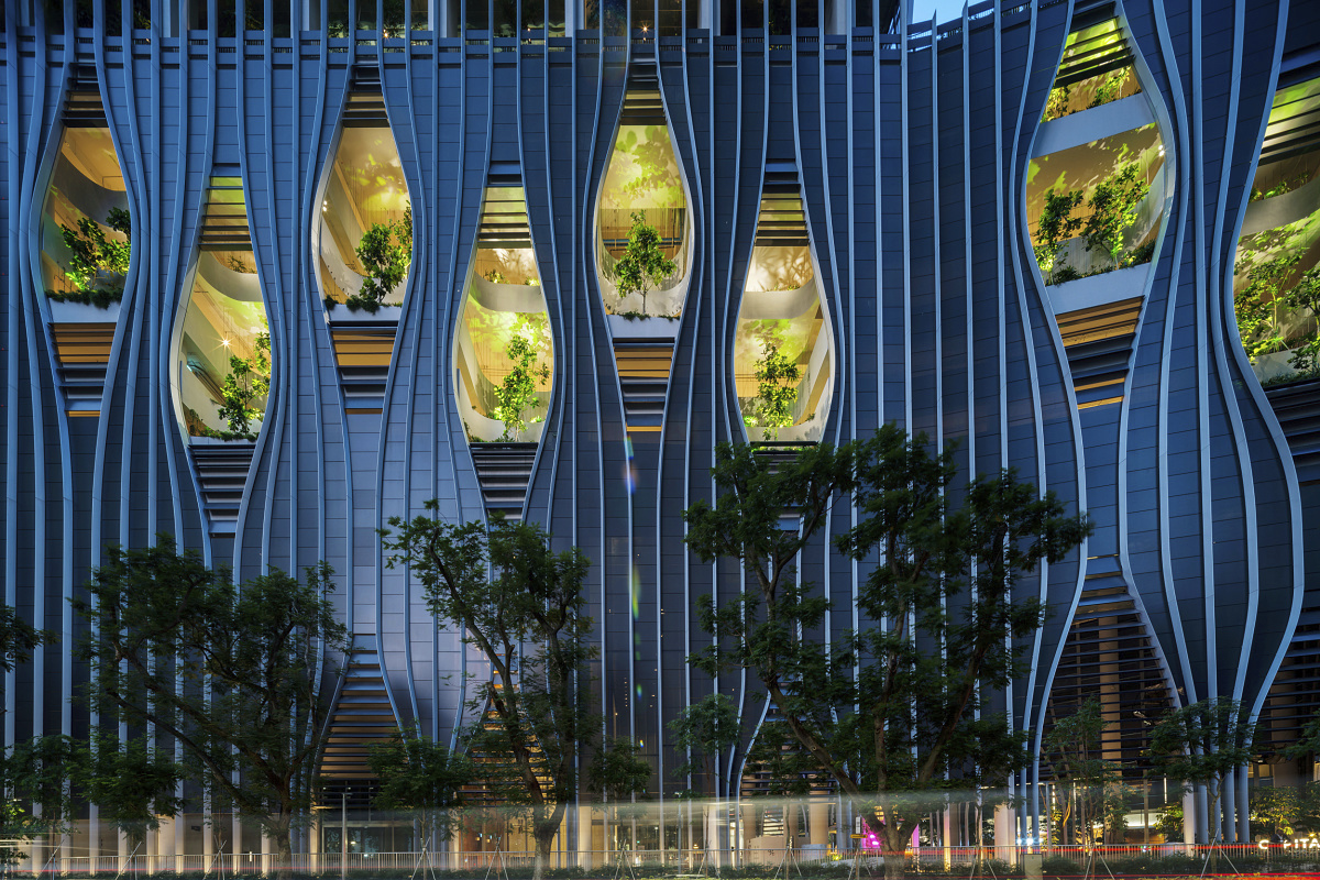 CapitaSpring building in Singapore featuring ERCO outdoor lighting and green facade elements.