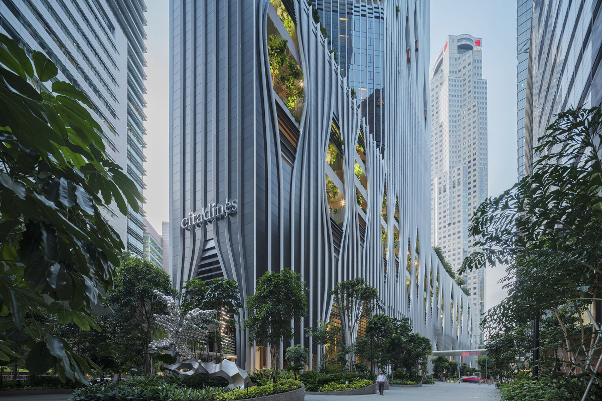 CapitaSpring building in Singapore featuring sustainable ERCO outdoor lighting for visual comfort.