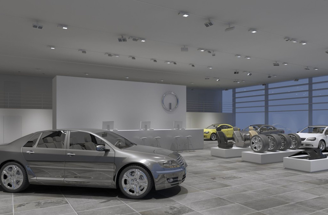 Car dealership interior featuring ERCO lighting to highlight vehicles and accessories.