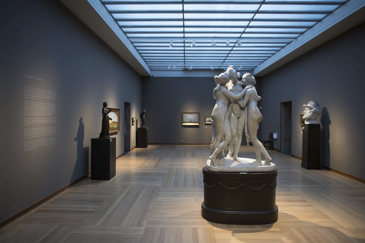 Sculpture in Glyptoteket museum illuminated by ERCO track spotlights.